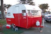Old 1956 Shasta trailer nicely restored in 2 tone red and white paint scheme